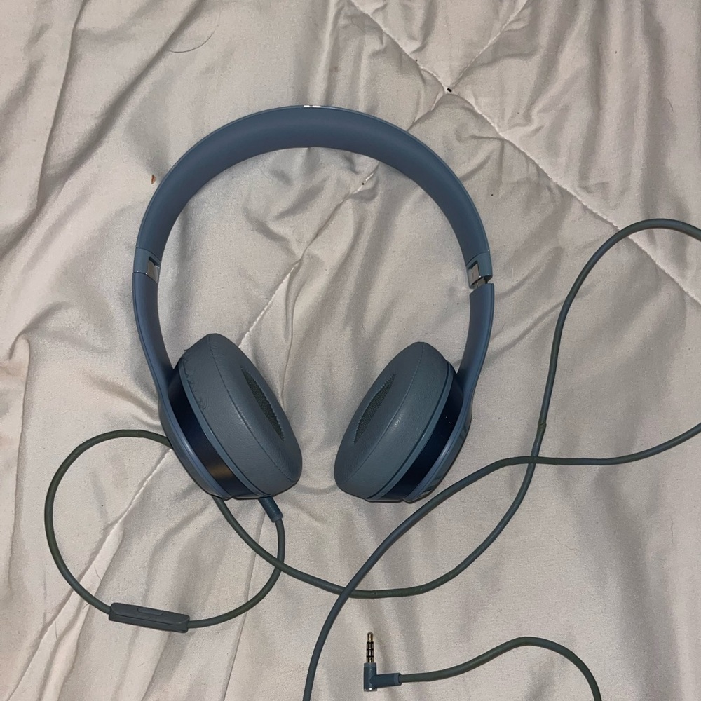 Light blue grey beats headphones